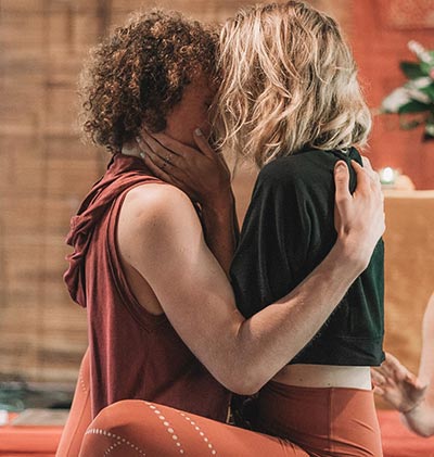 Couple embracing while practising mindful breathing