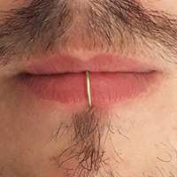 Non-piercing gold plated lip rings for men.