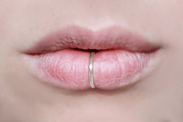 fake lip rings being worn on womens lips