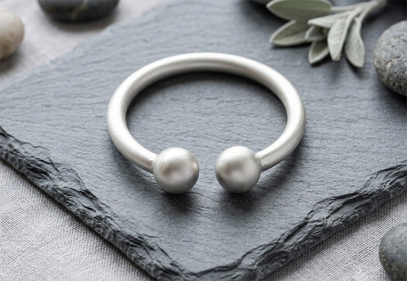 Matt finish two-ball frenulum cock ring