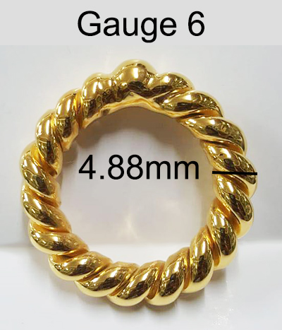 Gold Love Bump penis ring showing twisted ring width